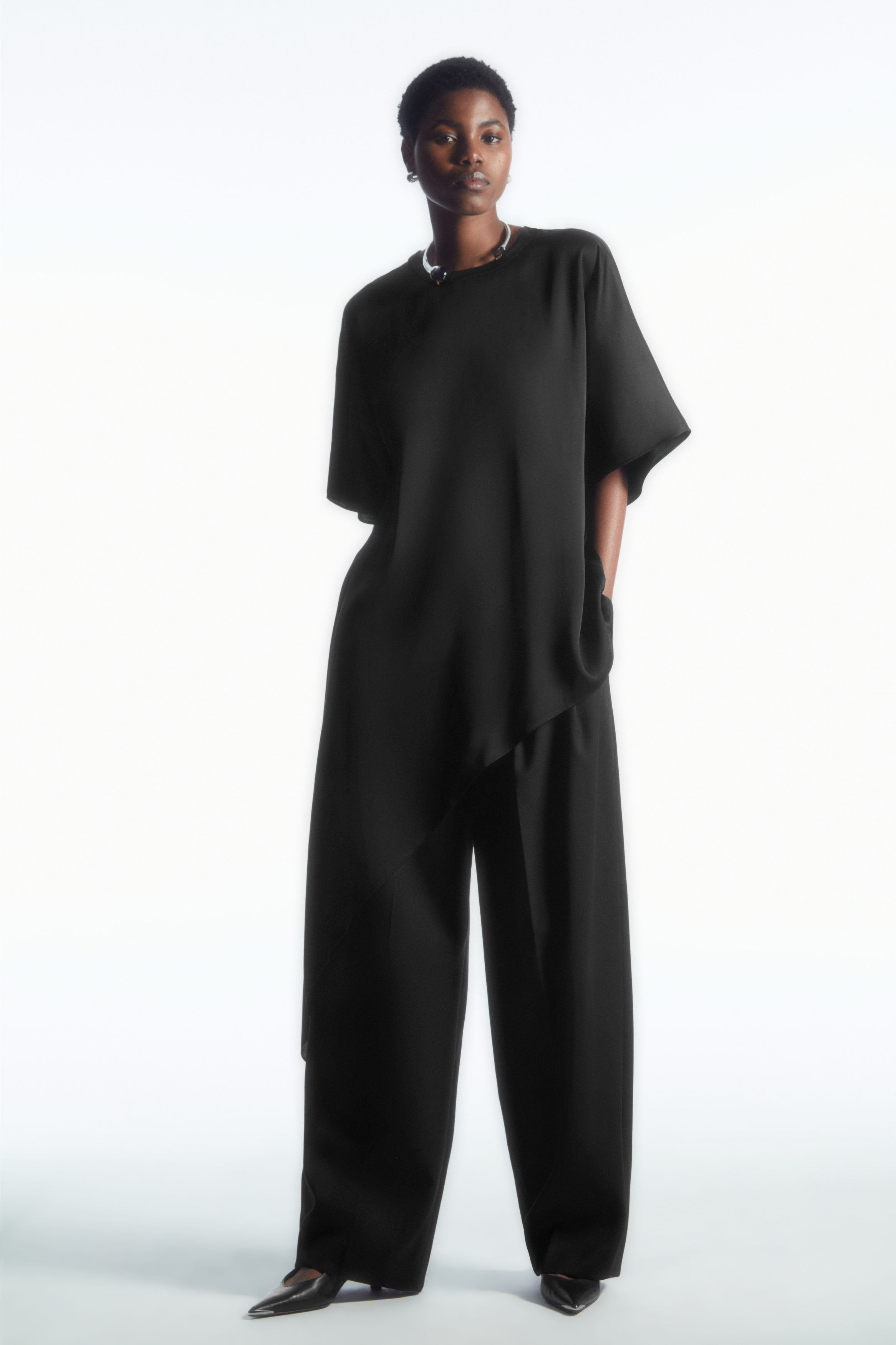 Buy COS Pintucked Flared Trousers in Black 2024 Online